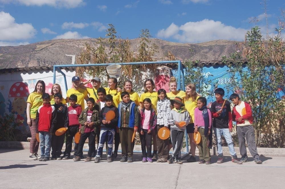 Group of young students and volunteer teachers in Peru.