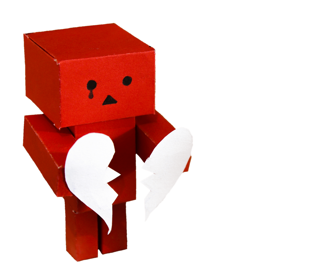 Red cardboard person, holding a broken heart.