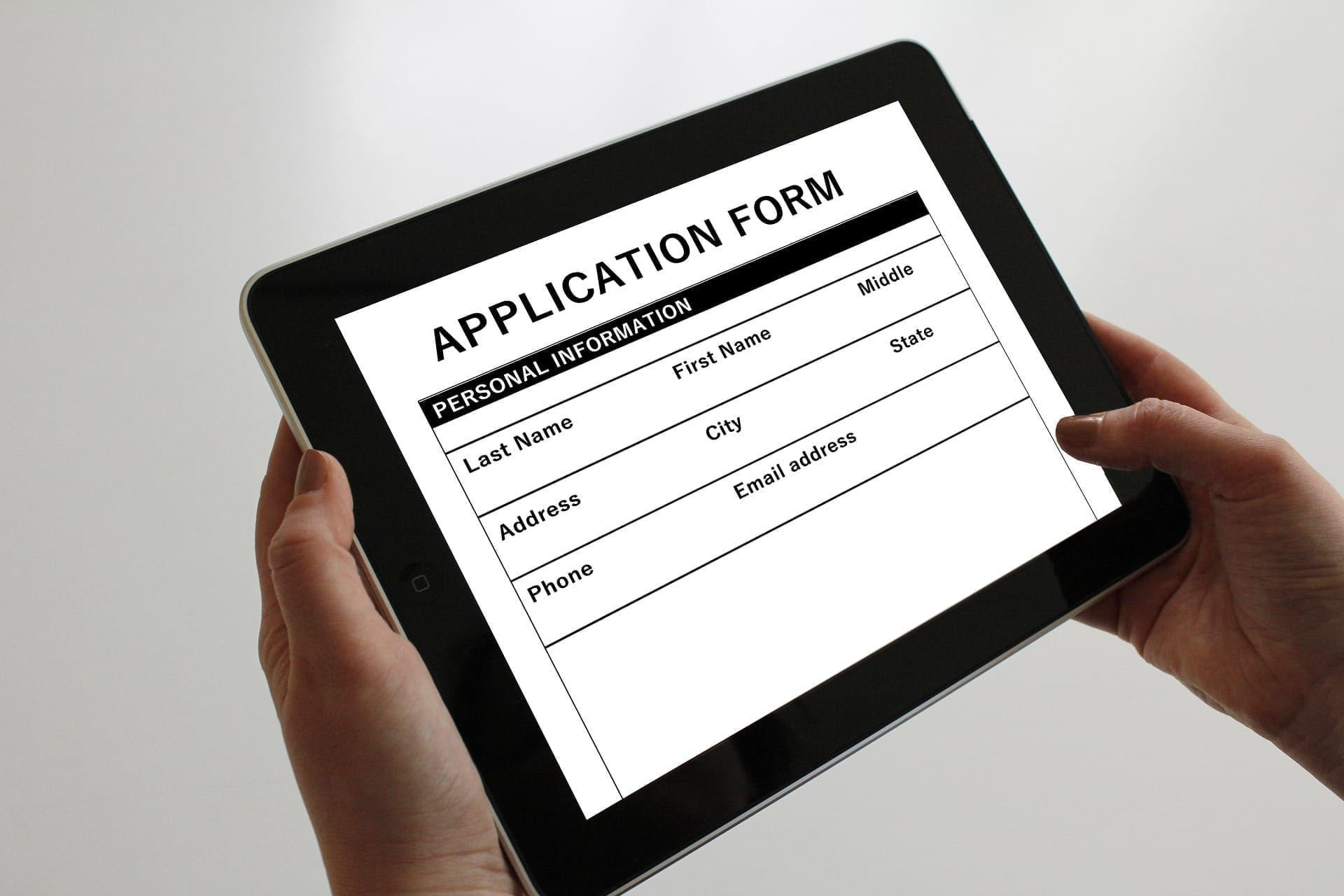 ipad with application form on it