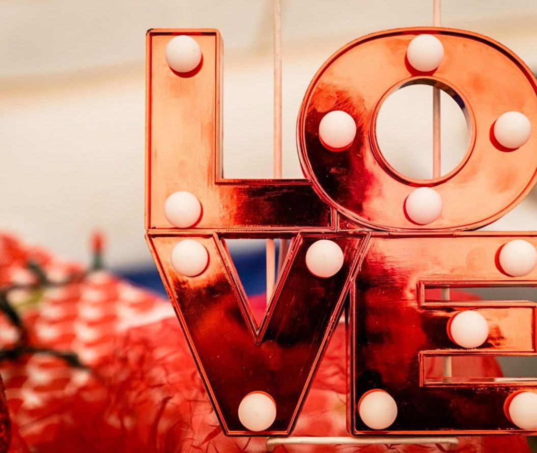 Red decoration saying LOVE surrounded by red paper