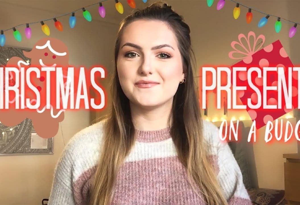 Thumbnail of a girl smiling, with a graphic of Christmas lights, saying 'Christmas presents on a budget'