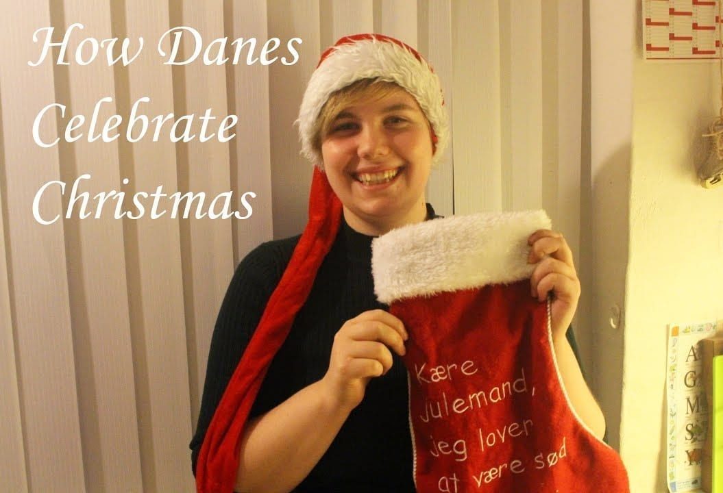 Thumbnail of a girl smiling holding a Christmas stocking and a hat, saying 'How Danes celebrate Christmas'