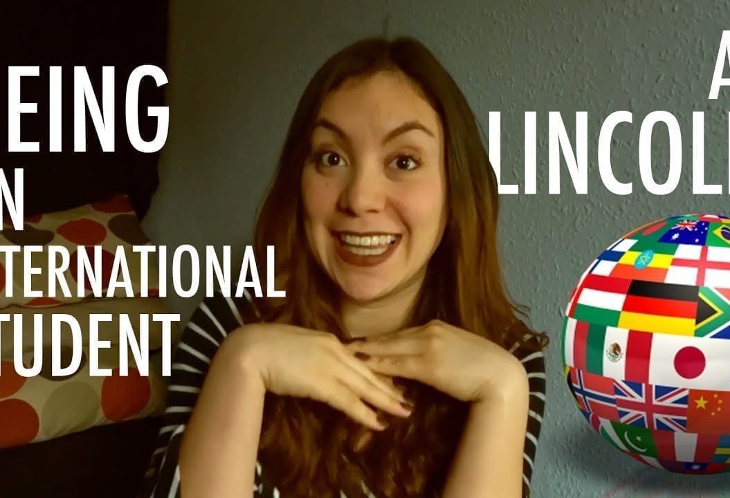 Thumbnail of a girl smiling, next to a globe covered in flags of the world, saying 'Being an international student at Lincoln'