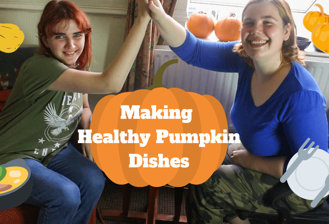 Two girls high five. A graphic of a pumpkin is in the middle with the text on top saying 'Making healthy pumkin dishes'.