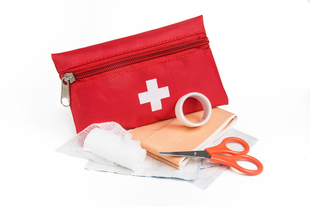 A red First Aid kit.