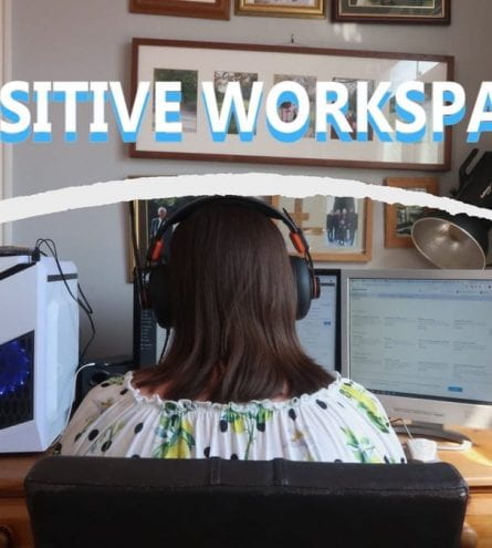 A girl sat at a computer, it reads: positive workspace