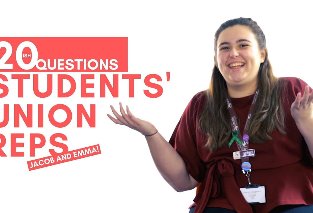 Thumbnail of a girl shrugging whilst smiling. The text reads: 20ish questions Students' Union Reps. Jacob and Emma.