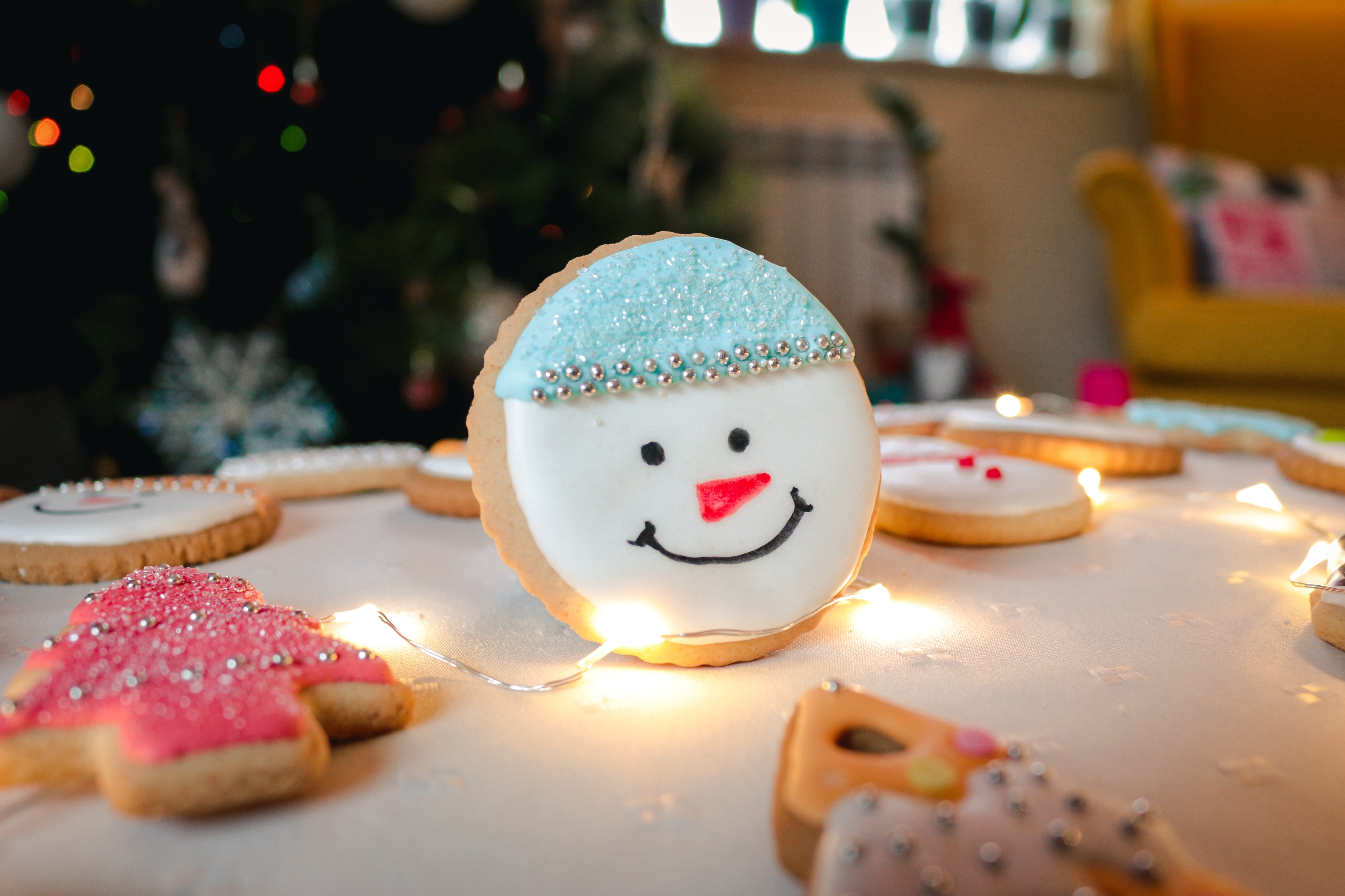 a christmas cookie with the face of a snowman