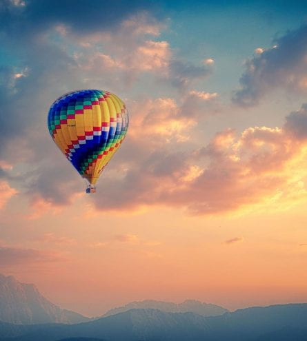 Hot air balloon in the air during sunrise