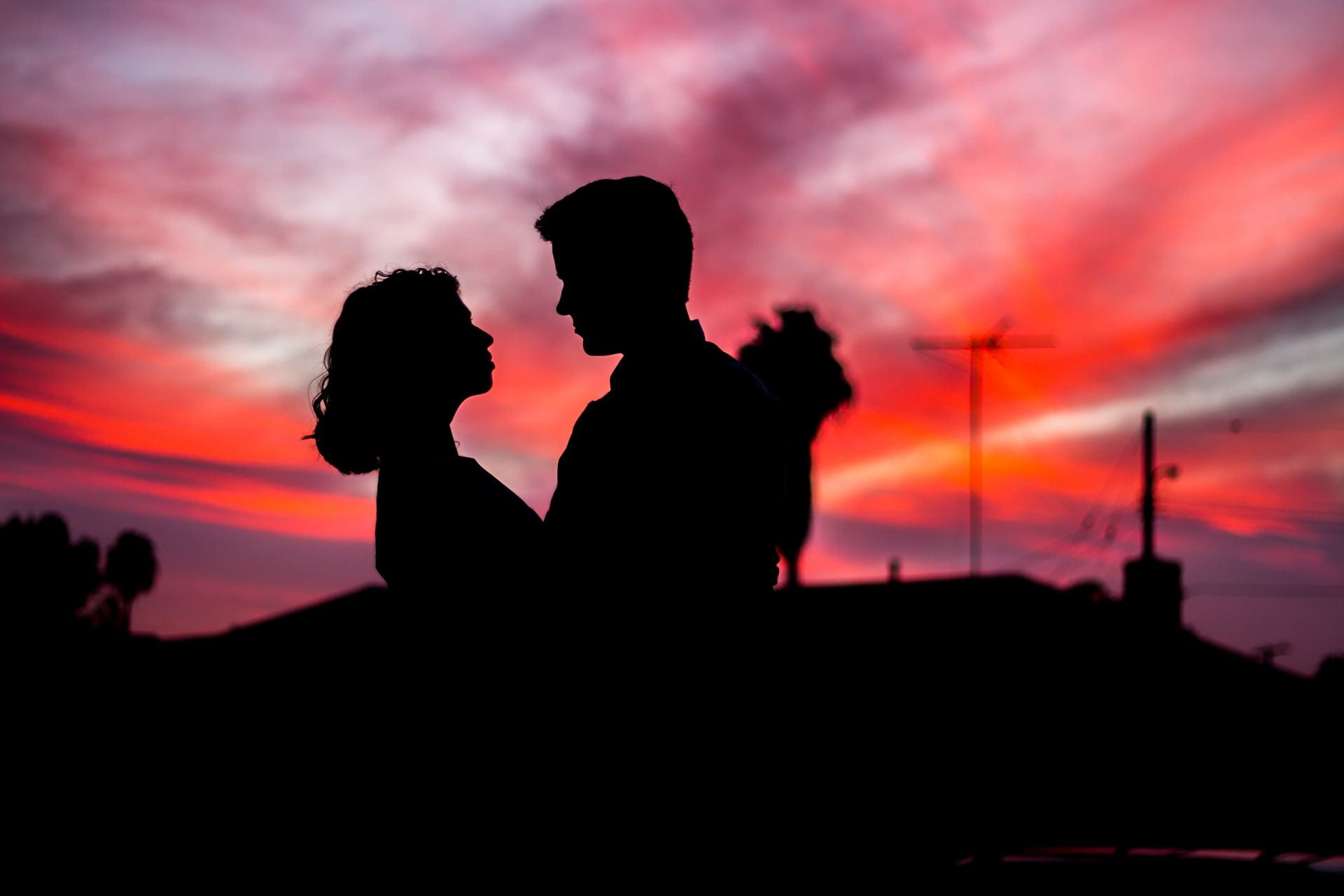 silhouette of a couple in front of sunset
