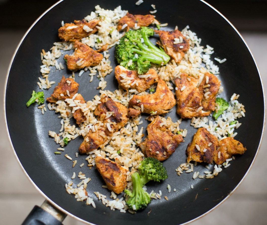Chicken, rice and broccoli in a frying pan