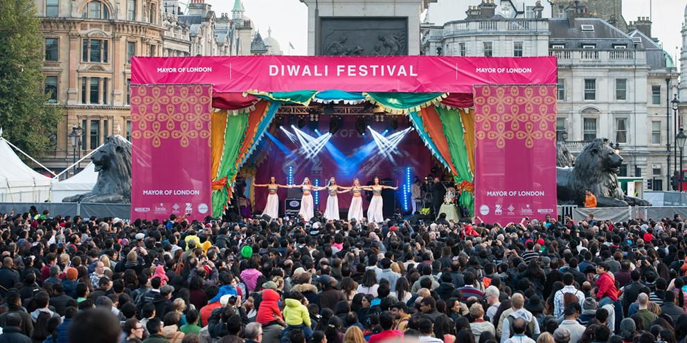 A Diwali celebration in London with performers on a stage