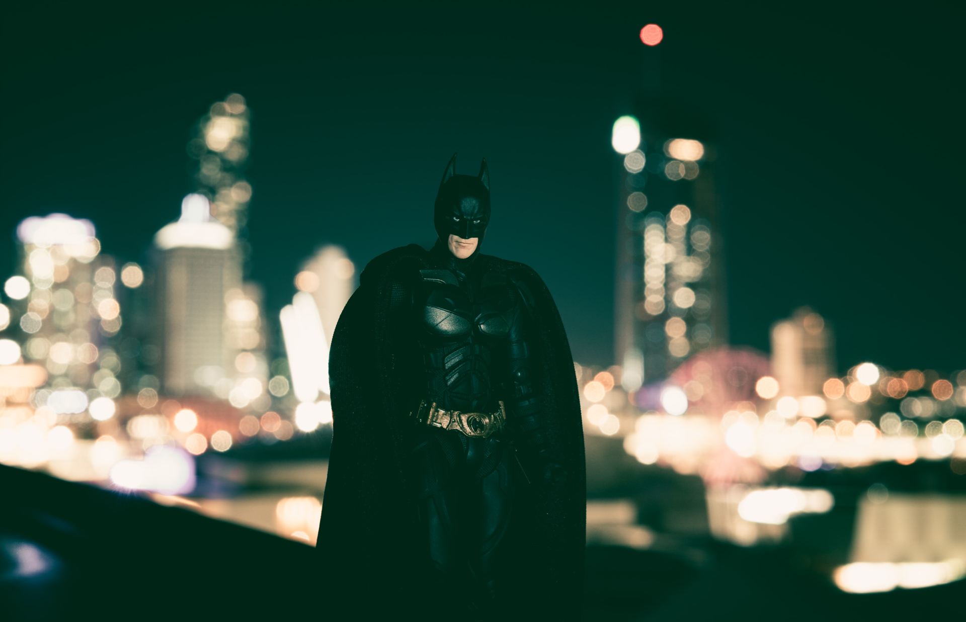 batman in front of a city