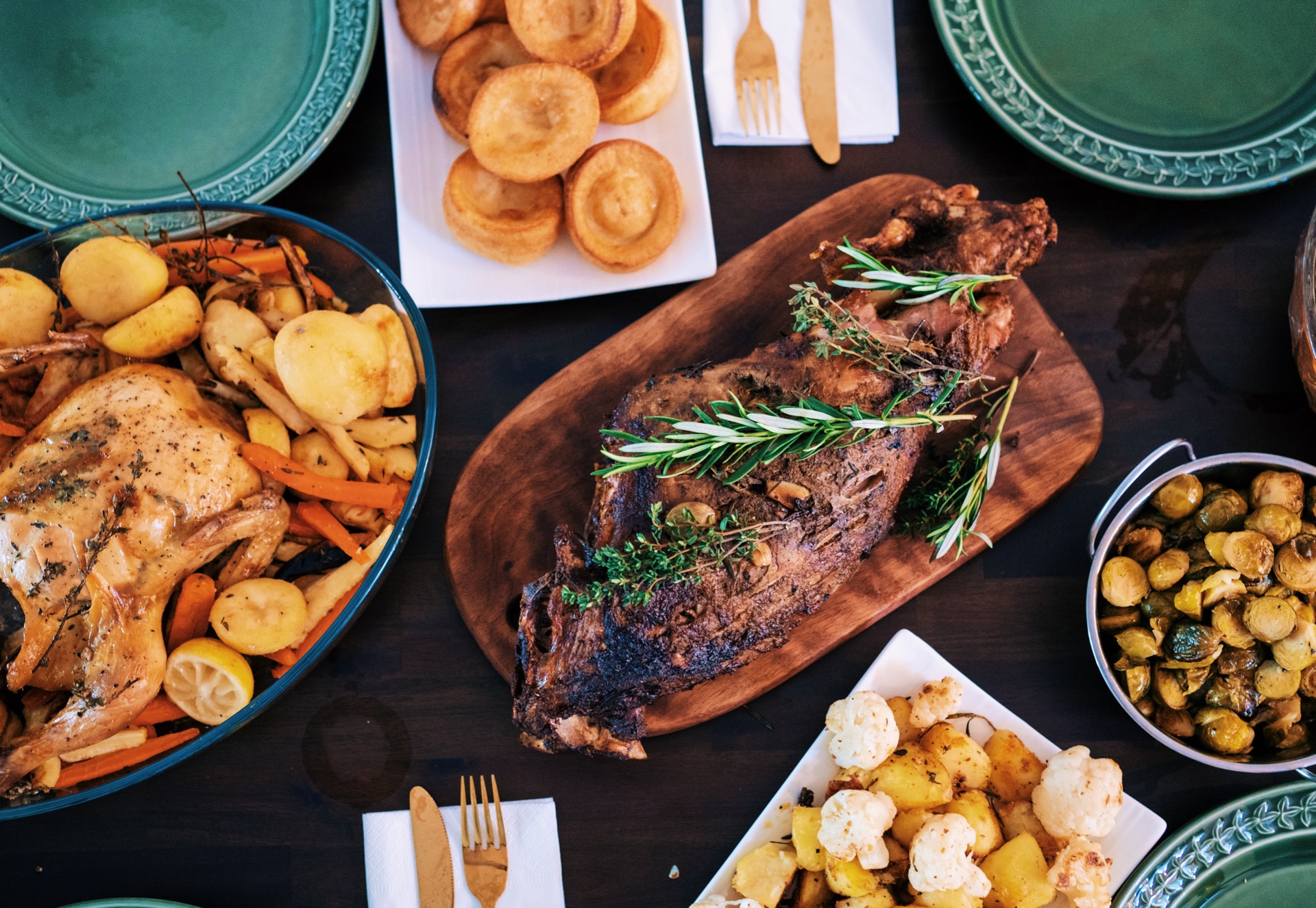 food on the table: some meat, potatoes, roast vegetables