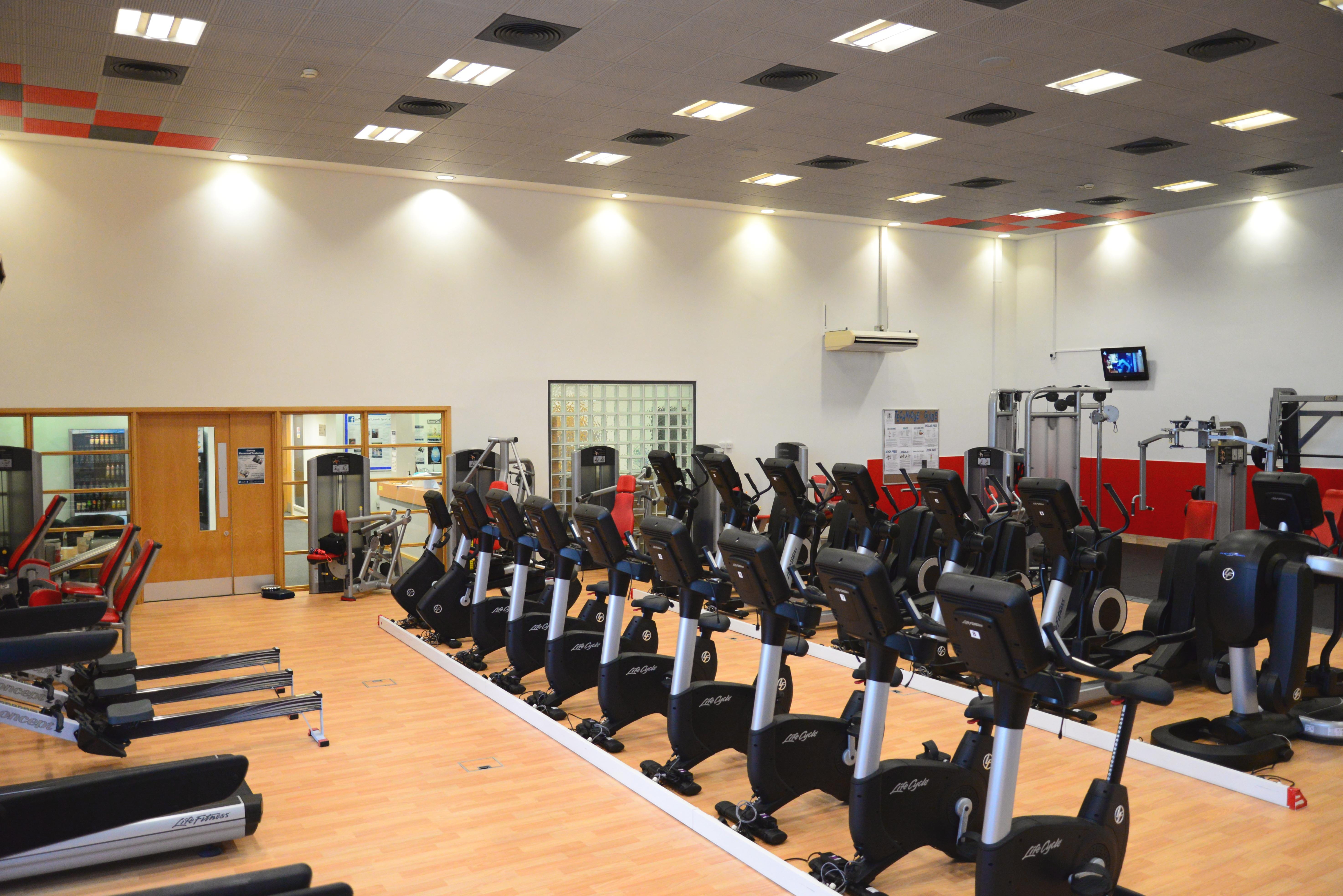 a picture of the university of lincoln gym showing treadmills, stationary bikes, cross trainers, weight machines, and free weights