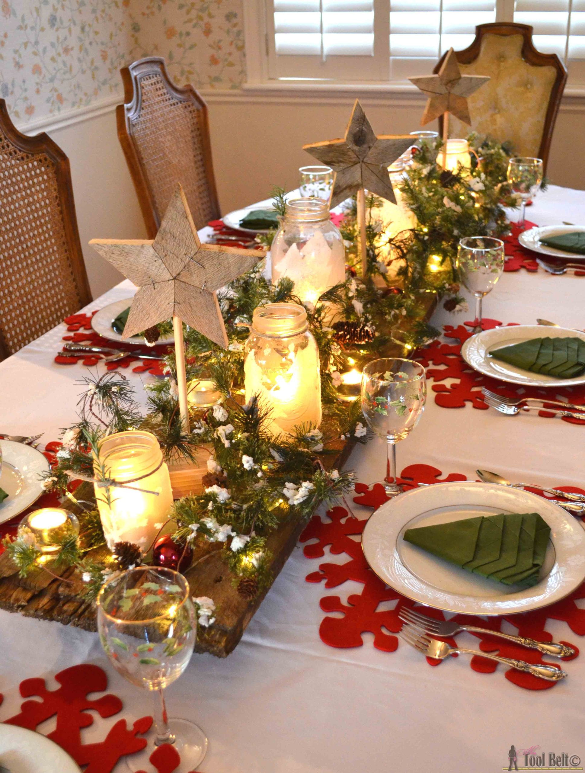 A dining table set up with Christmas decorations.